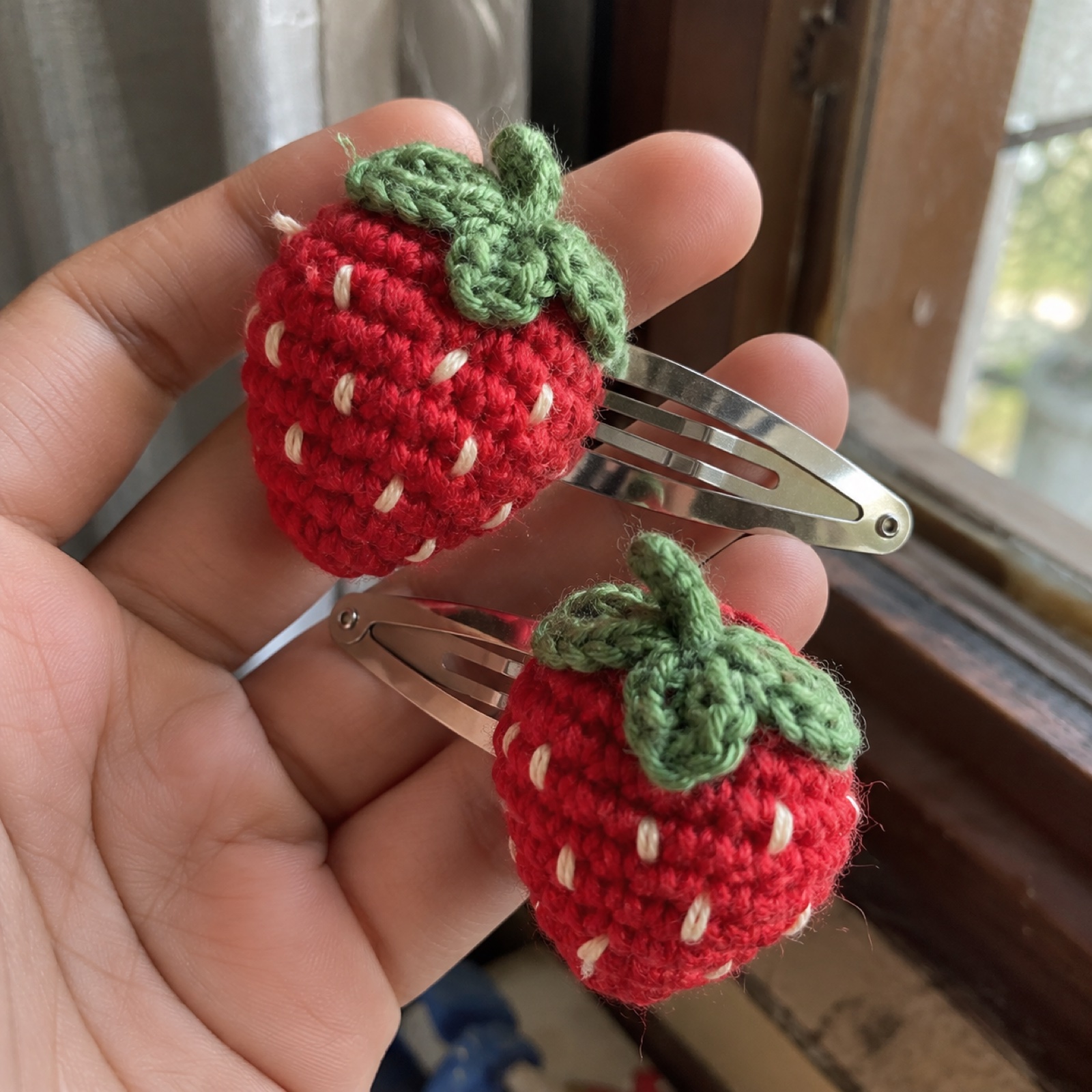 Close-up of the stitches on the Strawberry Hair Clips (Pair)