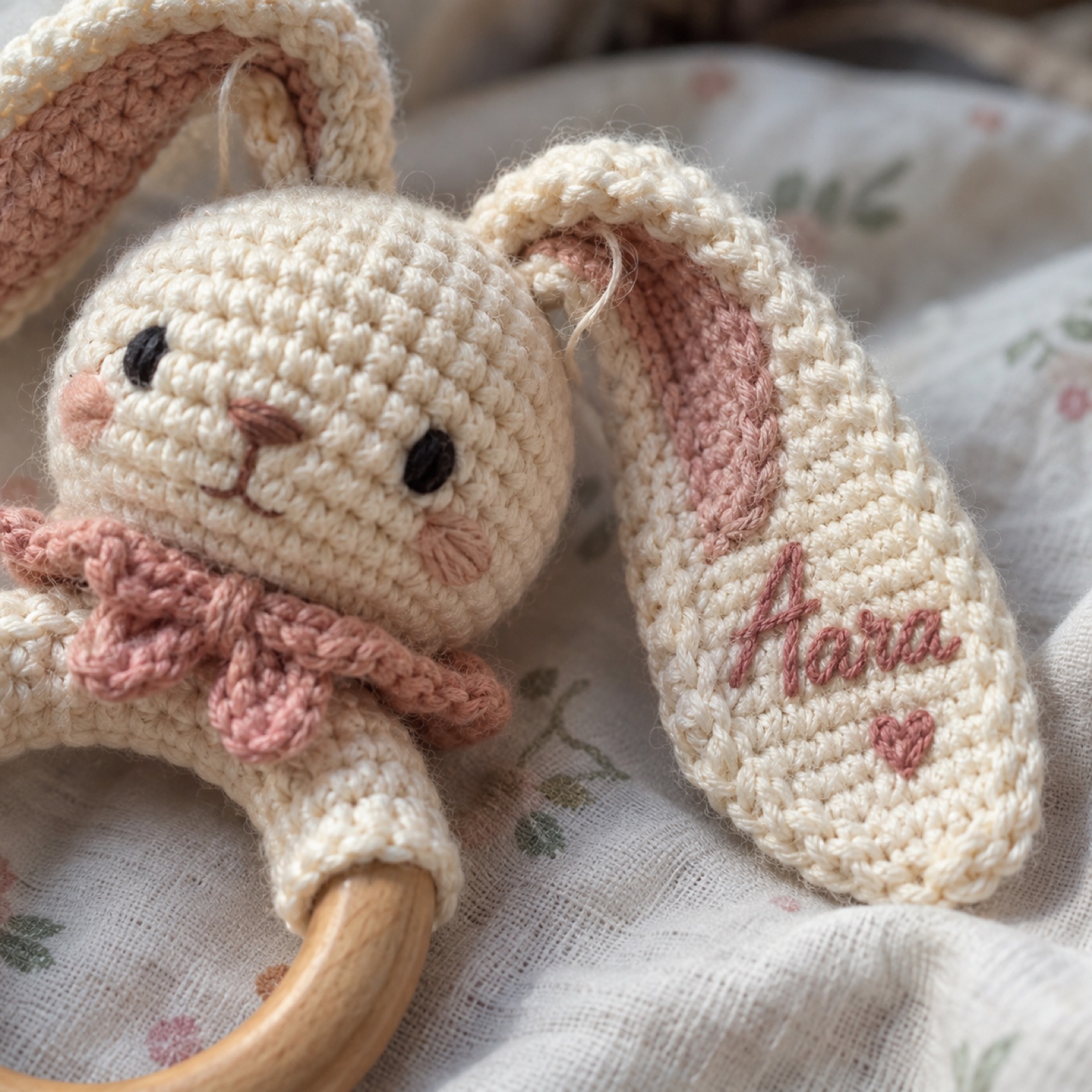 Close-up of the embroidered name on the bunny's ear on the Personalised Bunny Rattle