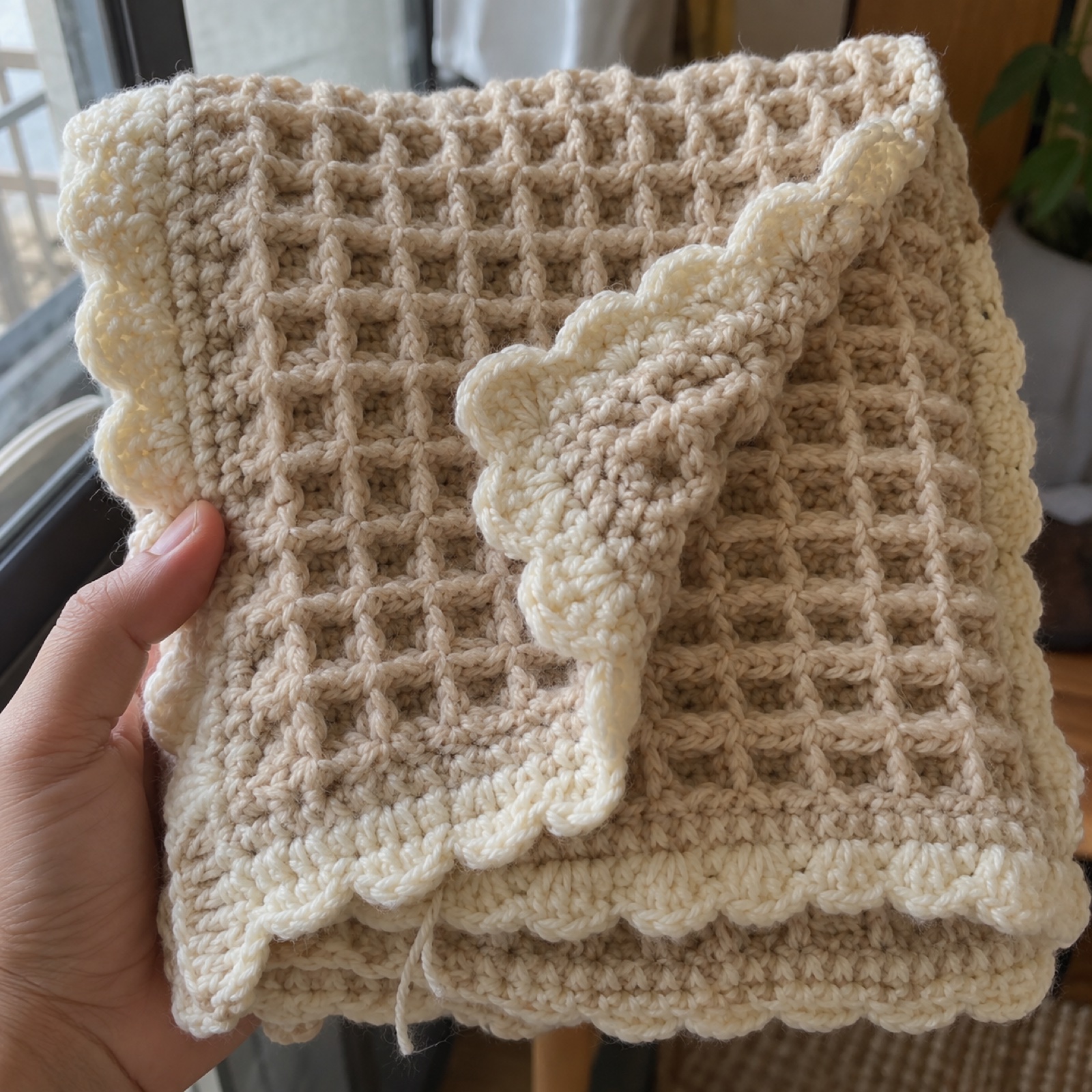 Close-up of the waffle-stitch grid and scalloped border on the Waffle Cloud Baby Blanket