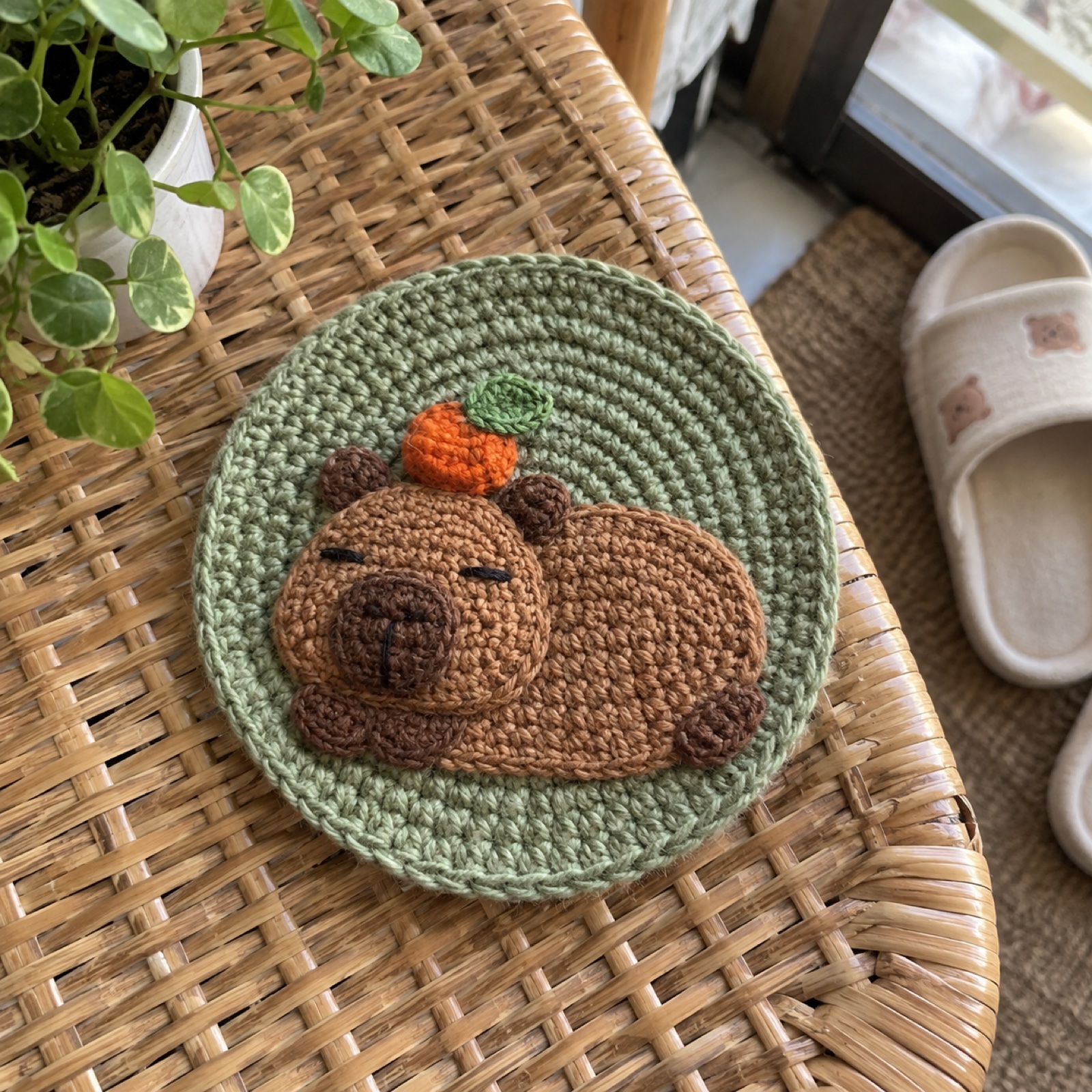 Capybara Chill Coaster: handmade crochet round coaster with a chill capybara appliqué