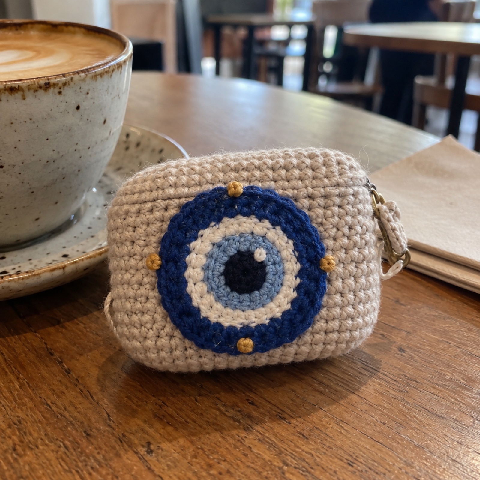 Nazar Earbuds Pouch: handmade crochet earbuds pouch with a nazar na lage appliqué