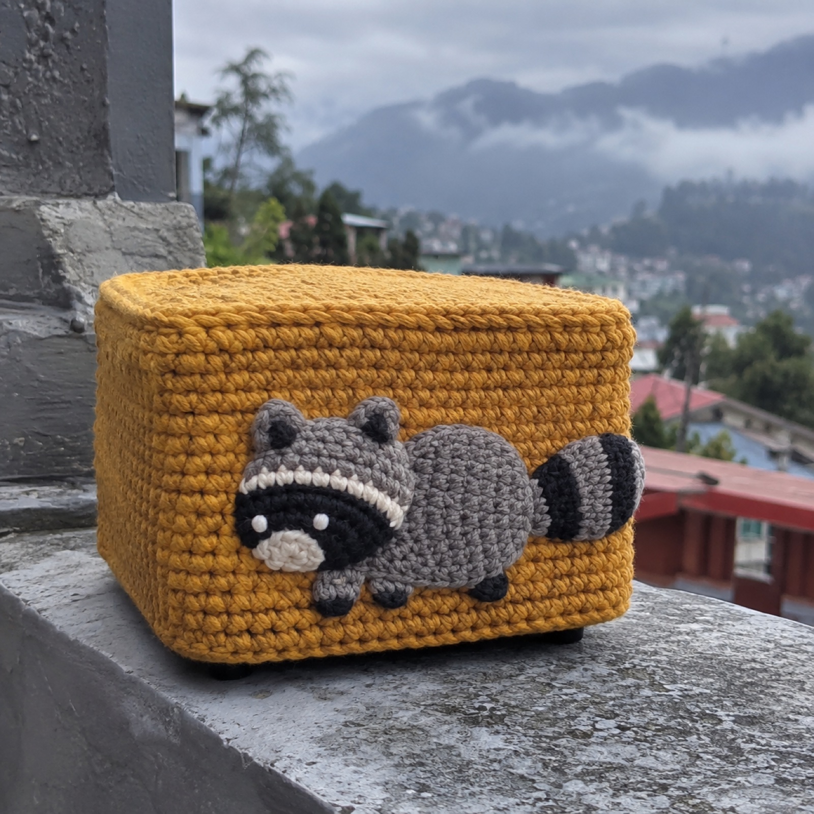 Unbothered Raccoon Mini PC Cap: handmade crochet mini pc cover with a unbothered short raccoon appliqué