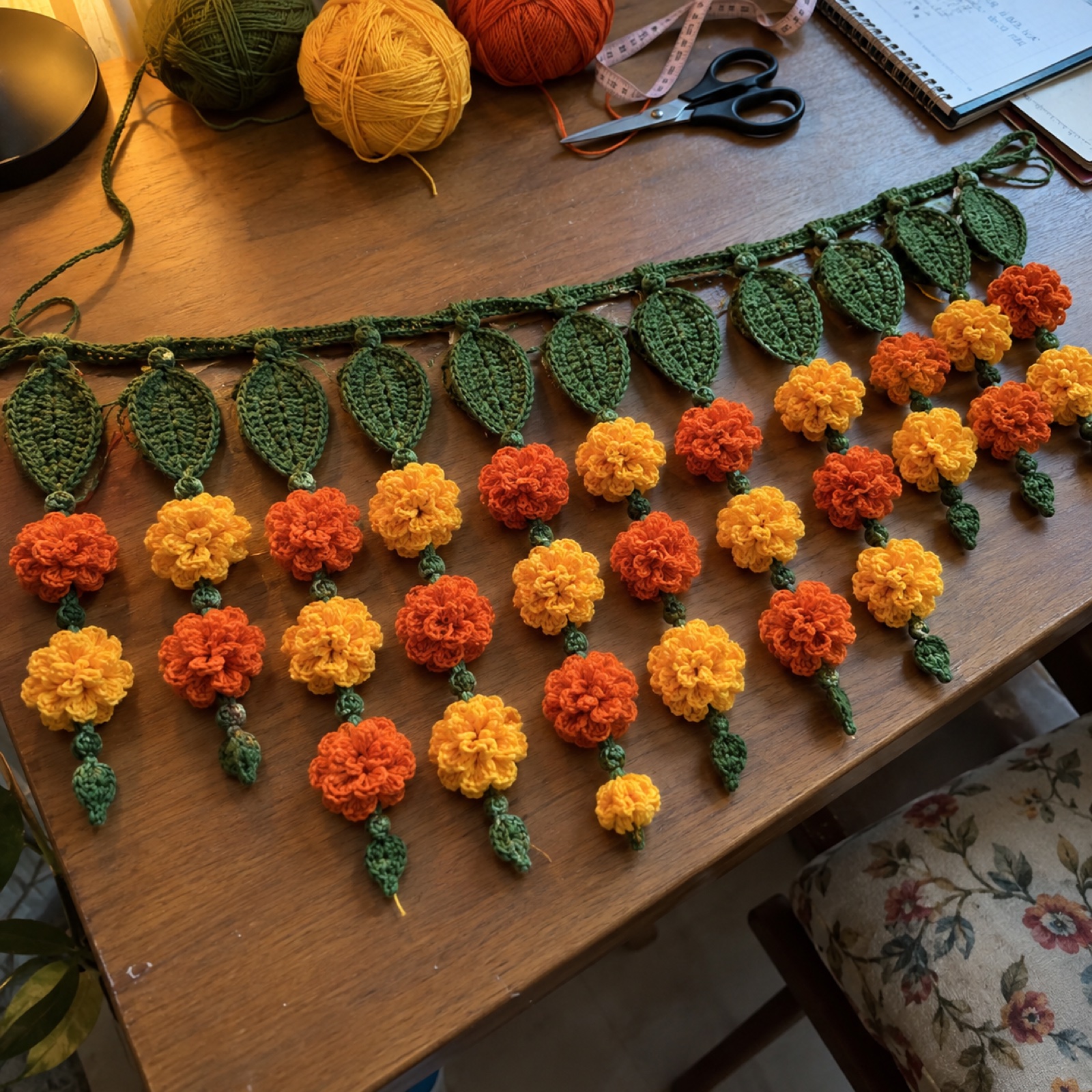 Marigold Diwali Toran: handmade crochet in marigold orange, saffron yellow, mango-leaf green