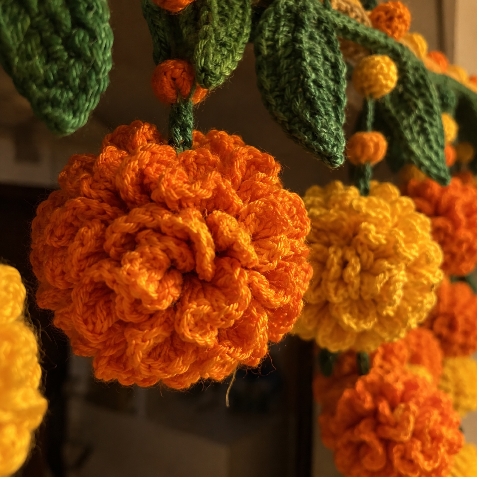 Close-up of the dense ruffled petals of one marigold on the Marigold Diwali Toran