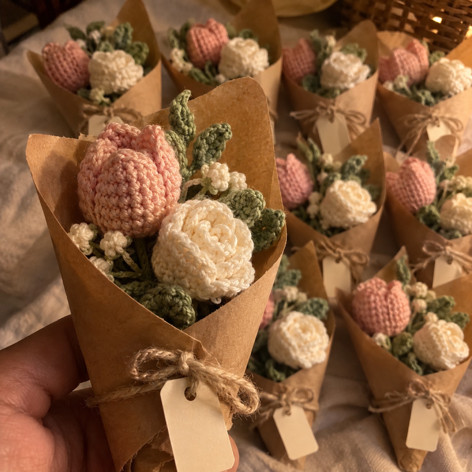 Close-up of one mini posy's tulip and rosebud inside its kraft cone on the Wedding Mini Bouquet Favours (Set of 10)