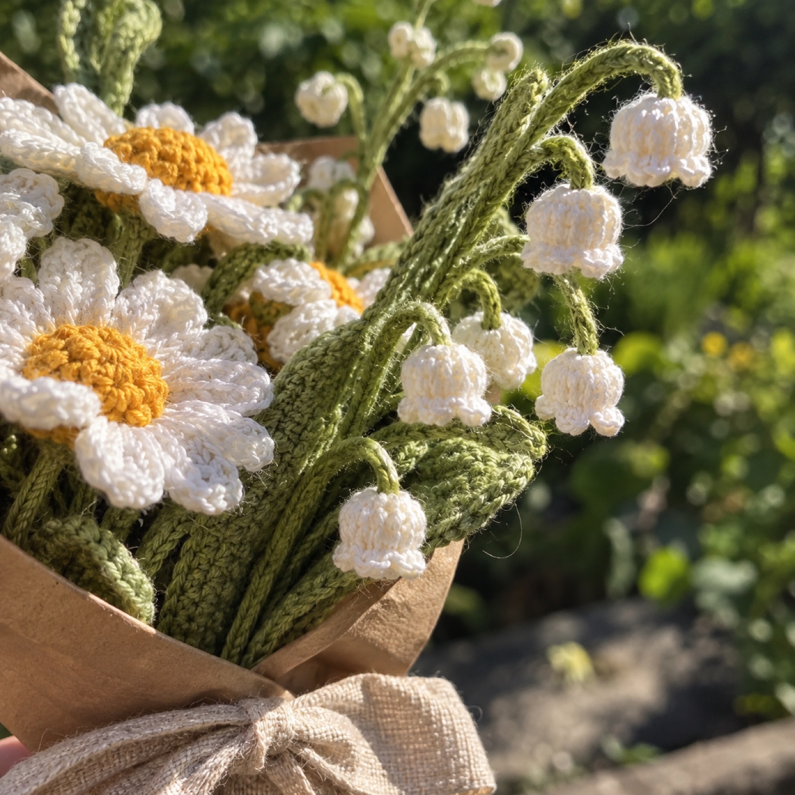 Close-up of the tiny white lily-of-the-valley bells hanging from the stem on the Daisy & Lily-of-the-Valley Posy