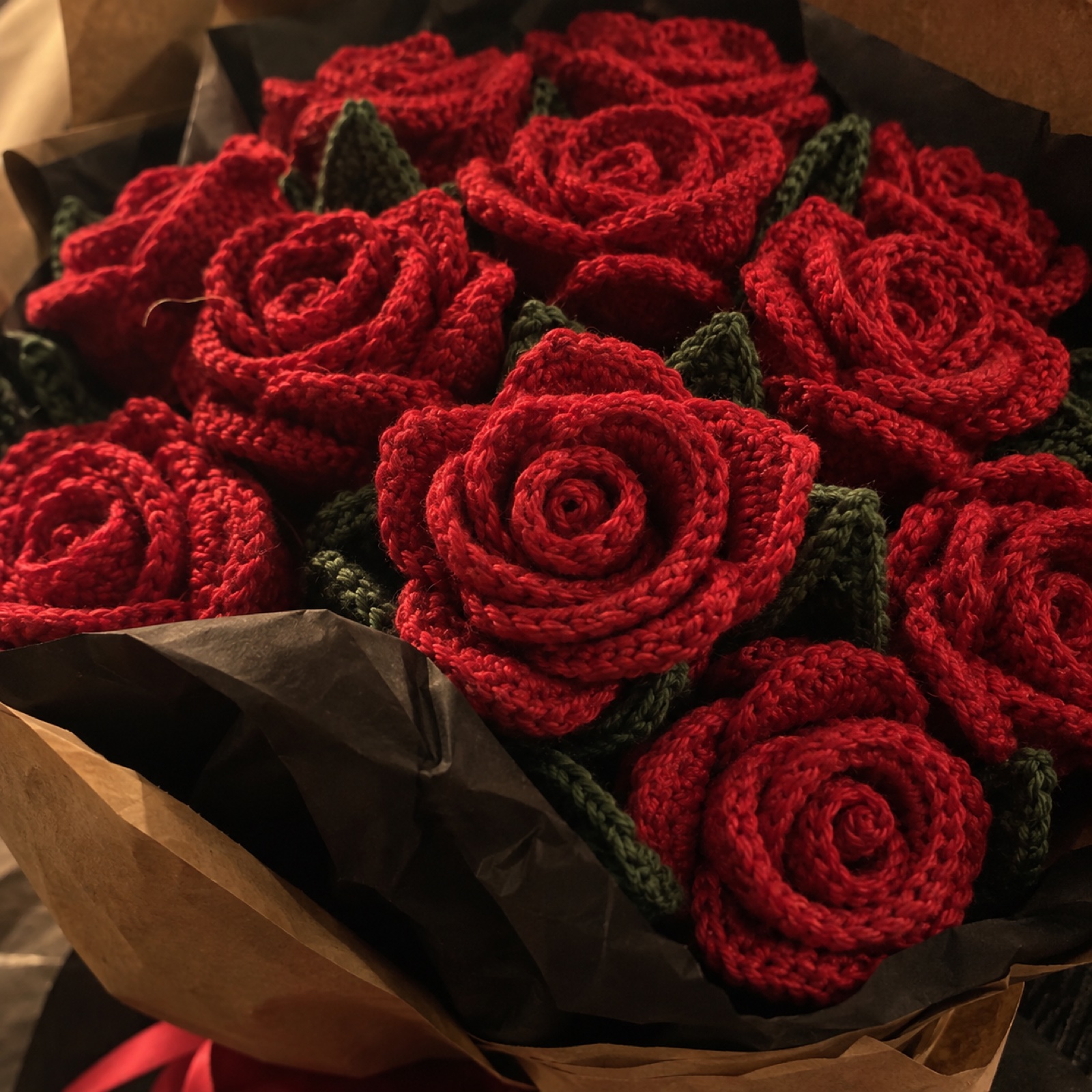 Close-up of the spiral-rolled petals at the heart of a red rose on the Red Rose Dozen