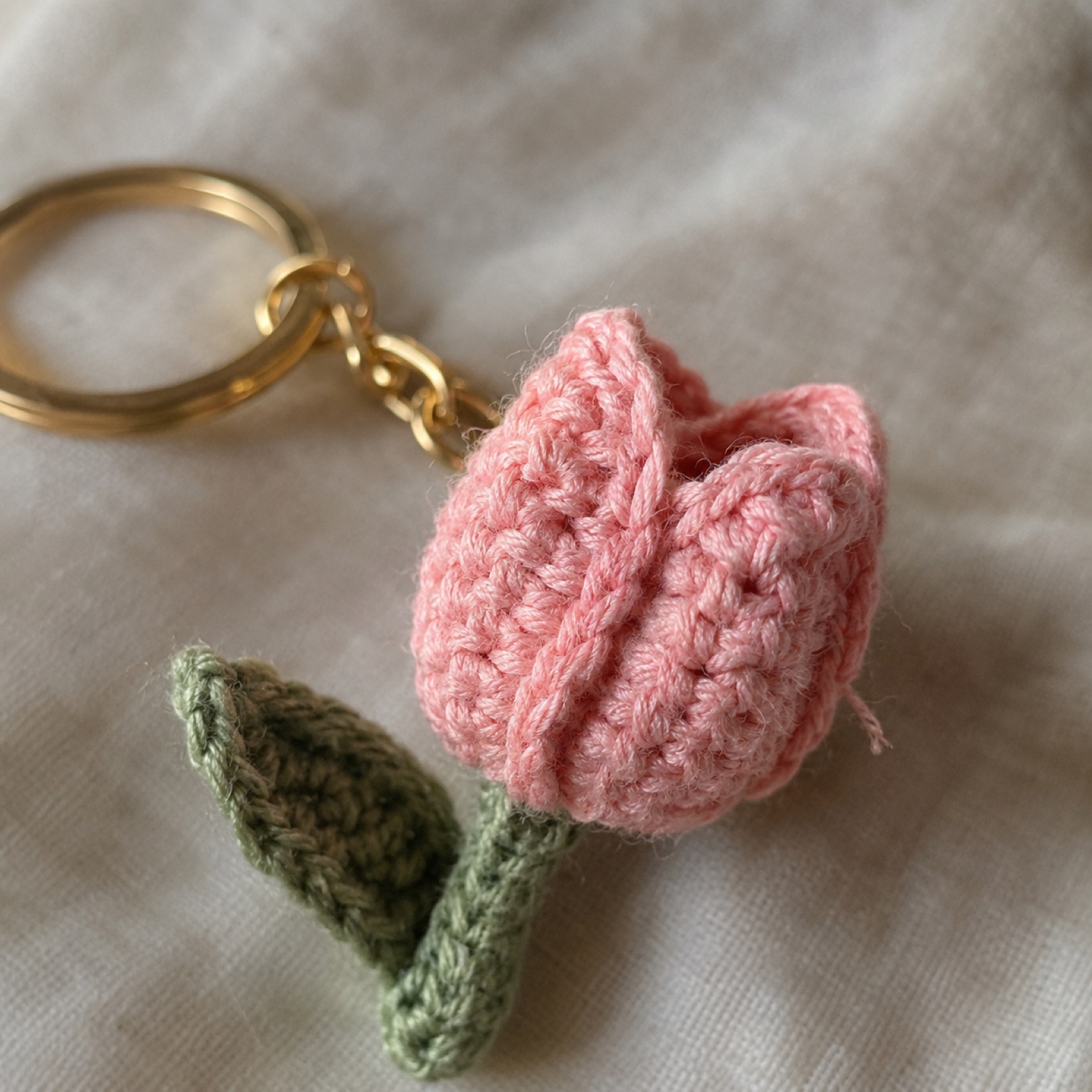 Close-up of the cupped blush petals of the mini tulip on the Mini Tulip Keychain