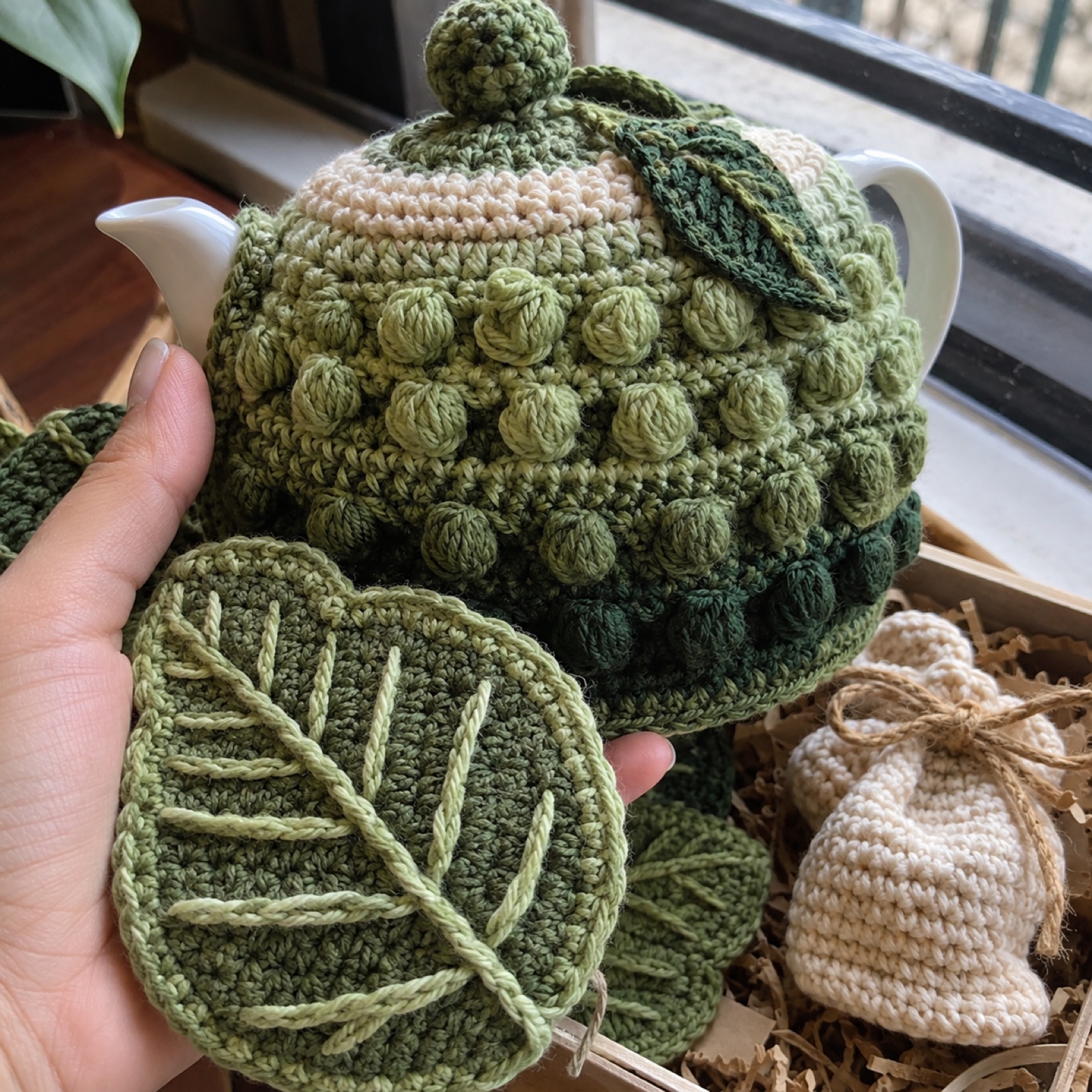 Close-up of the tea cosy's bobble rows beside a leaf coaster's veins on the Darjeeling Morning Tea Hamper