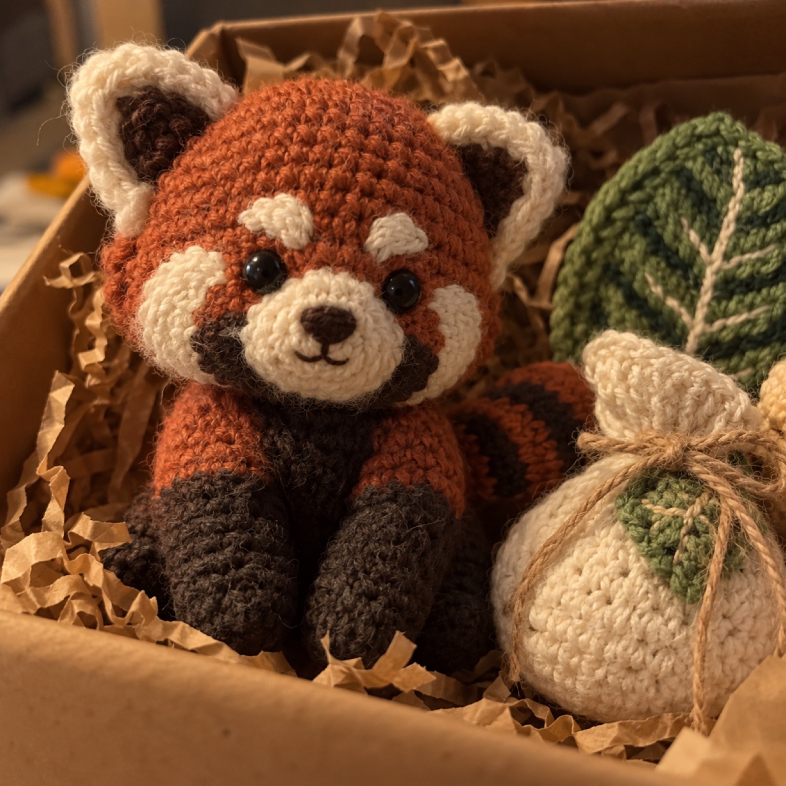 Close-up of the red panda's face markings and small ear on the Red Panda & Tea Gift Box
